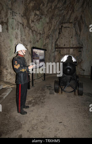Military helmet and cannon Stock Photo