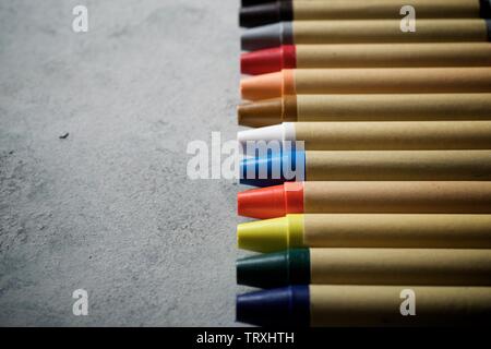 Group of wax crayons on a table.