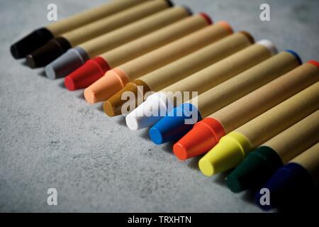 Group of wax crayons on a table.