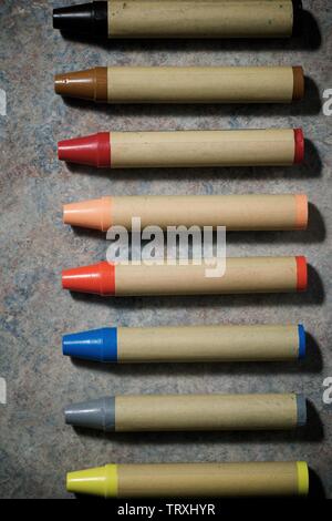 Group of wax crayons on a table.