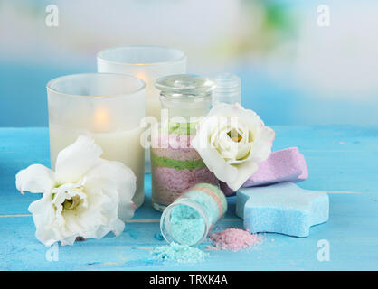 Composition with Aromatic salts in glass bottles,  on blue background Stock Photo