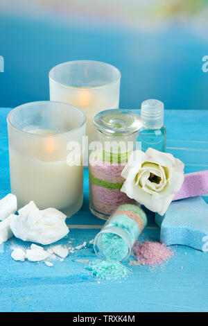 Composition with Aromatic salts in glass bottles,  on blue background Stock Photo