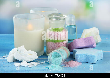 Composition with Aromatic salts in glass bottles,  on blue background Stock Photo