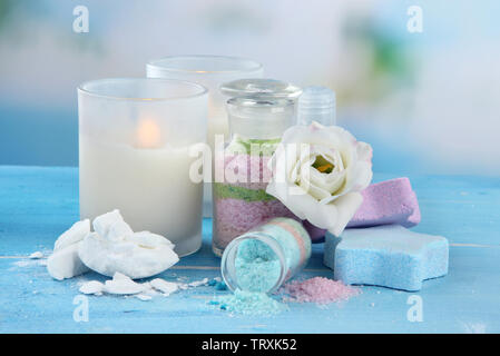 Composition with Aromatic salts in glass bottles,  on blue background Stock Photo