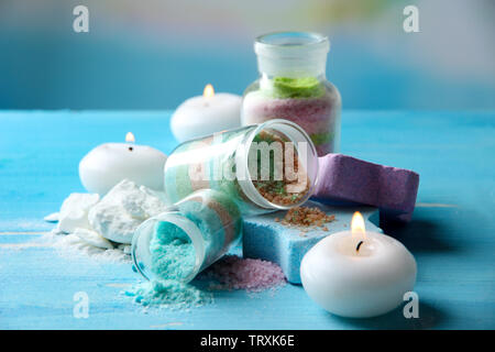 Composition with Aromatic salts in glass bottles,  on blue background Stock Photo