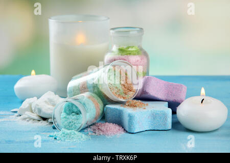 Composition with Aromatic salts in glass bottles,  on blue background Stock Photo