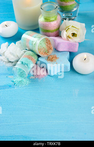 Composition with Aromatic salts in glass bottles,  on blue background Stock Photo