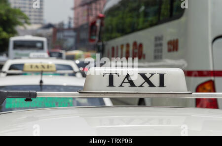 Manila, Philippines - September, 6, 2016: A taxi stuck in traffic on a road of Manila Stock Photo