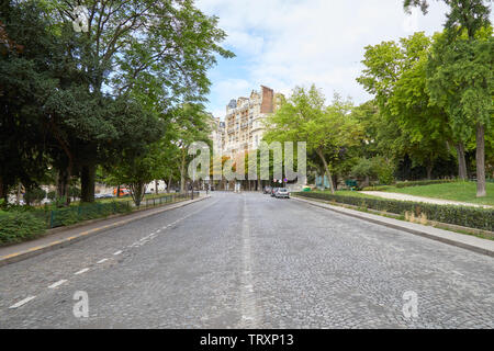 PARIS, FRANCE - JULY 23, 2017: Empty street in Paris with garden and ancient buildings in France Stock Photo