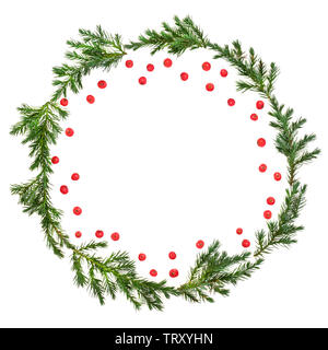 Winter and Christmas juniper fir wreath with loose red holly berries on white background with copy space. Traditional symbol for the festive season. J Stock Photo