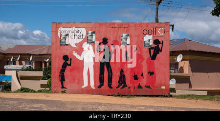 Brightly coloured shop made out of shipping container selling mobile phones in rural area on the Wild Coast, Transkei, South Africa Stock Photo