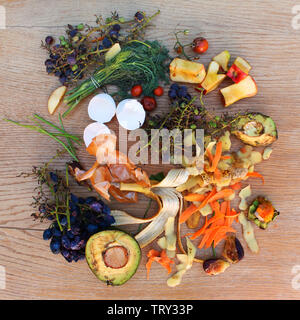 Domestic waste for compost from fruits and vegetables on the table. Stock Photo