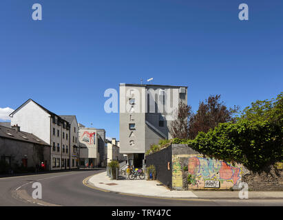 Distant street view with cinema's name engraved in concrete facade. Pálás Cinema, Galway, Ireland. Architect: dePaor, 2017. Stock Photo