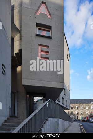 Perspective along entrance and concrete street facade. Pálás Cinema, Galway, Ireland. Architect: dePaor, 2017. Stock Photo