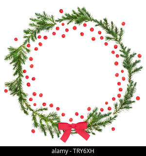 Winter and Christmas juniper fir wreath with red bow and loose holly berries on white background with copy space. Traditional symbol for the festive s Stock Photo