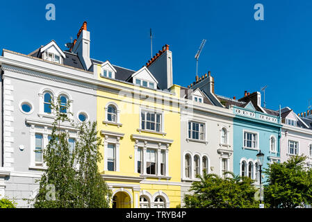 Colourful English Victorian Houses in Notting Hill, a district in West London in the Borough of Kensington and Chelsea Stock Photo