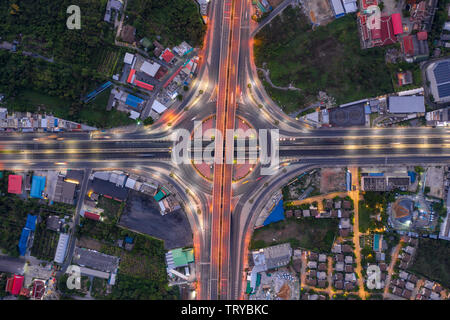 Aerial view of highway junctions Top view of Urban city, Bangkok at night, Thailand. Stock Photo