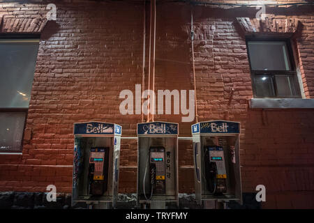 TORONTO, CANADA - NOVEMBER 14, 2018: Bell Canada Payphone in Toronto in evening in derelict environment. Bell Canada is one of main phone booth provid Stock Photo