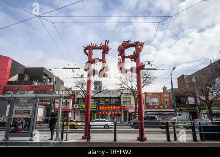 TORONTO, CANADA - NOVEMBER 14, 2018: Dragon gates in the entrance of the Toronto West Chinatown, in Ontario. it is the Chinese ethnic district located Stock Photo