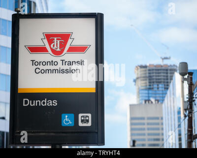 TORONTO, CANADA - NOVEMBER 14, 2018: TTC logo on the entrance of Dundas subway station in Downtown Toronto, Ontario. Toronto Transit Commission is the Stock Photo