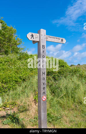 Signpost on the Pembrokeshire Coast Path at Broad Haven, Wales Stock Photo