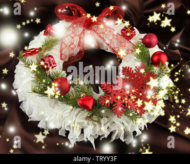 Christmas wreath on fabric background Stock Photo