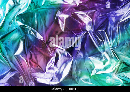 Modern beautiful holographic background of blurred crumpled foil. Trendy 80's style. Wallpaper design. Stock Photo
