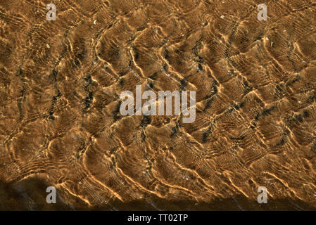 design formed by flowing water on a stream Stock Photo