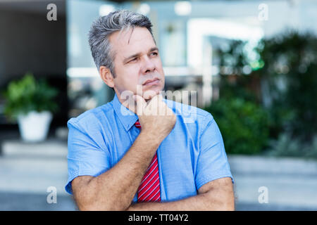 Jobless sad businessman thinking about his future and changes in life Stock Photo