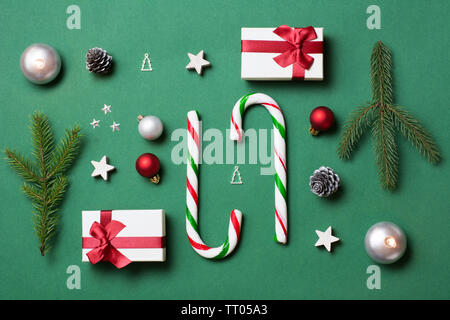 Green, white and red christmas composition with candy canes and gift boxes Stock Photo