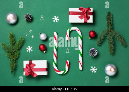 Green, white and red christmas composition with candy canes and gift boxes Stock Photo
