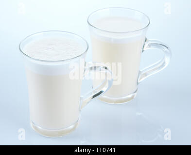 Cups of eggnog isolated on white Stock Photo