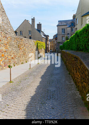 Standing on the quite, narrow cobbled streets of Granville, France. Stock Photo