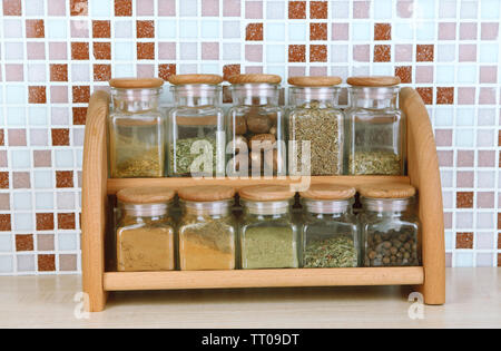Set of spices in kitchen on table on mosaic tiles background Stock Photo