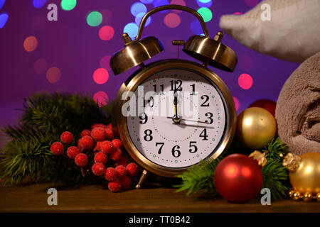 Wine glasses, retro alarm clock and Christmas decoration on bright background Stock Photo