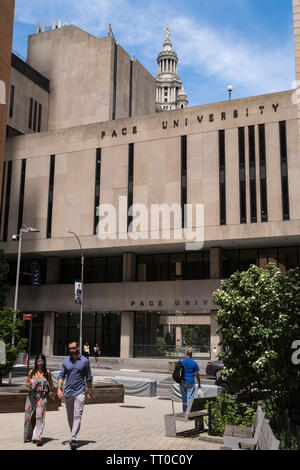 Pace University campus in Lower Manhattan with the Municipal Building towering in background, NYC, USA Stock Photo