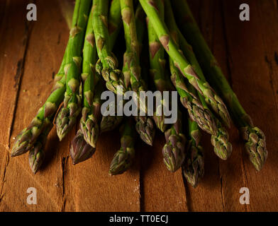 Fresh asparagus on wood Stock Photo