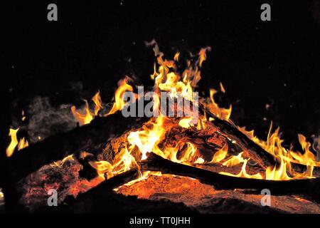 burning logs over campfire in the middle of the night in the outback of Australia Stock Photo
