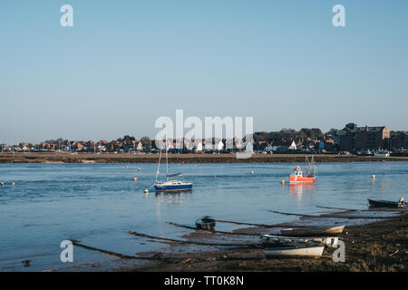 Wells-next-the-sea, UK - April 20, 2019: Fishing boats arriving to the Wells-next-the-sea port. Wells is a seaside town and port in Norfolk, UK, famou Stock Photo