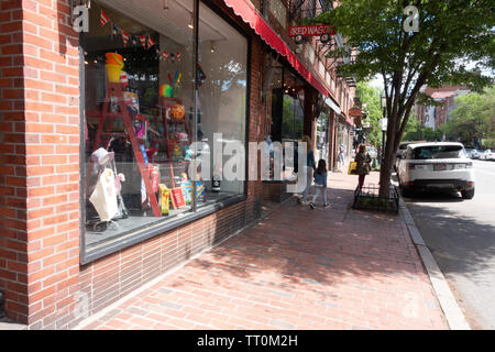 Brick storefronts and sidewalks on Charles Street in Beacon Hill, Boston Massachusetts Stock Photo