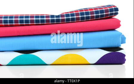 Pile of colored fabrics isolated on white Stock Photo