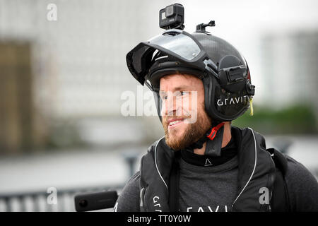 London, UK.  13 June 2019.  Richard Browning the Founder and Chief Test Pilot of Gravity Industries and ‘real life Iron Man’ previews their Race Series concept at Royal Victoria Docks, East London, during London Tech Week 2019, ahead of the launch of Gravity Industries’ International Race Series in early 2020.  Gravity Industries are the designers, builders and pilots of the world’s first patented Jet Suit, pioneering a new era of human flight. Credit: Stephen Chung / Alamy Live News Stock Photo