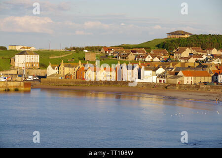 setting sun illuminating the fishing town of Eyemouth, a small town and civil parish in Berwickshire, in the Scottish Borders Stock Photo