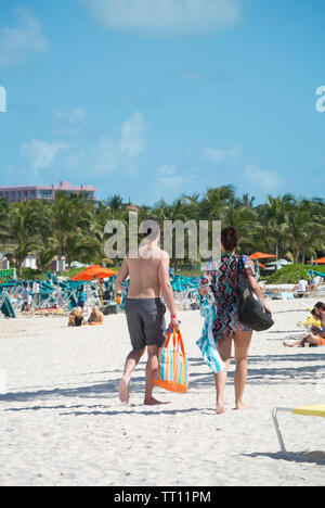 Couple walking in the beach Stock Photo
