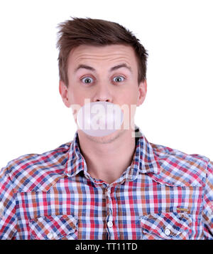 Young man blowing bubble of chewing gum isolated on white Stock Photo