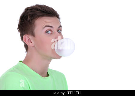 Young man blowing bubble of chewing gum isolated on white Stock Photo