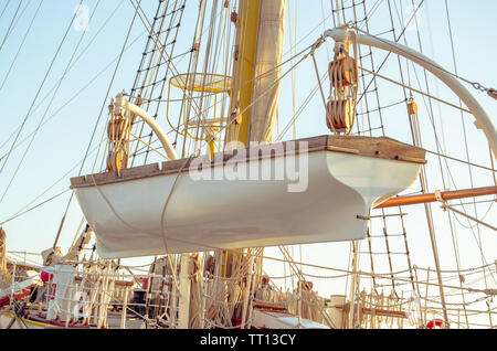 White boat is ready to be launched from sailboat.Close up Stock Photo ...