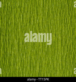 background from green chartreuse color corrugated paper close up Stock Photo