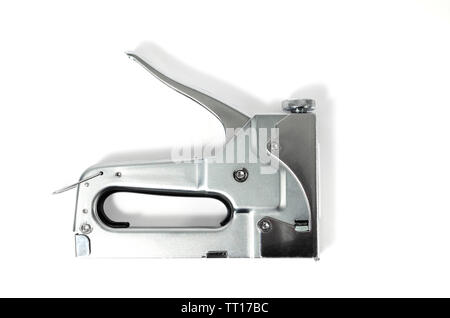 Metal Nickel plated stapler gun on white background, isolate close up. Stock Photo
