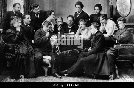 ANTON CHEKOV (1860-1904) Russian novelist and playwright (centre) reading his play The Seagull to colleagues at the Moscow Art Theatre in 1899. Third from right is Olga Knipper who he married in May 1901. Stock Photo